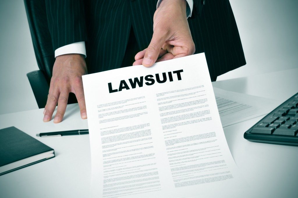 Lawyer showing copy of lawsuit