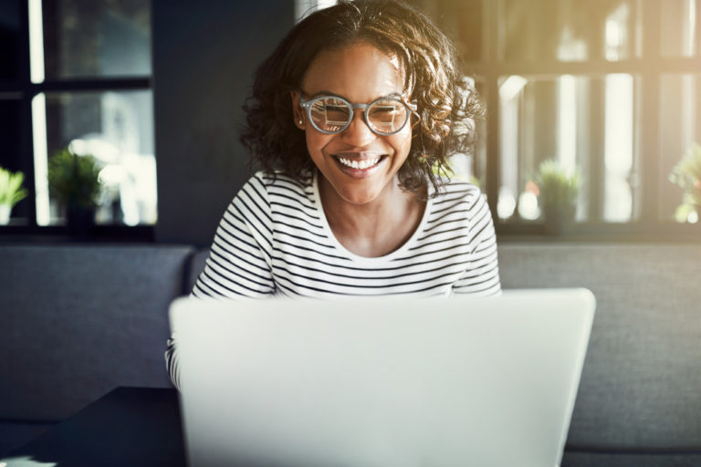 Female using her laptop at home