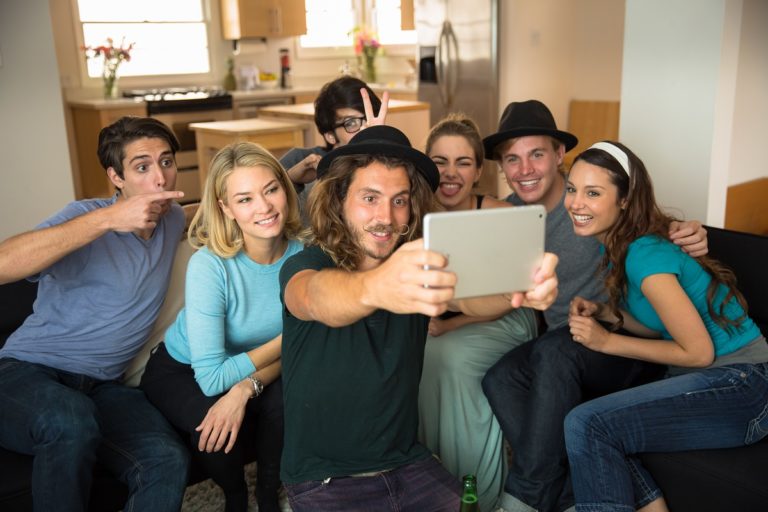 group of friends taking pictures