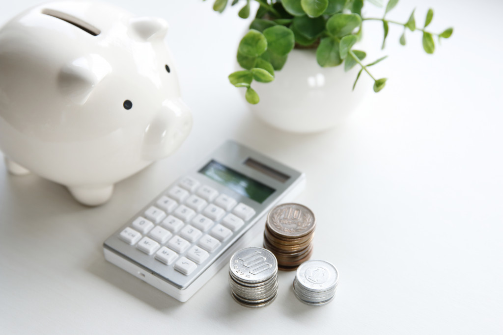 A money box and electronic calculator