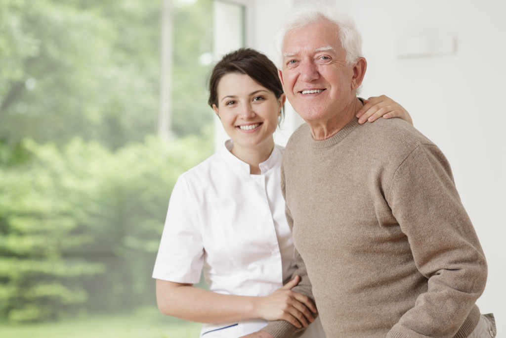 Nurse with elderly male resident