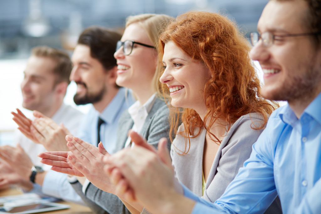 employees clapping after a seminar