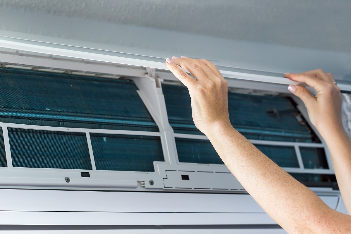 female hands opening air conditioning