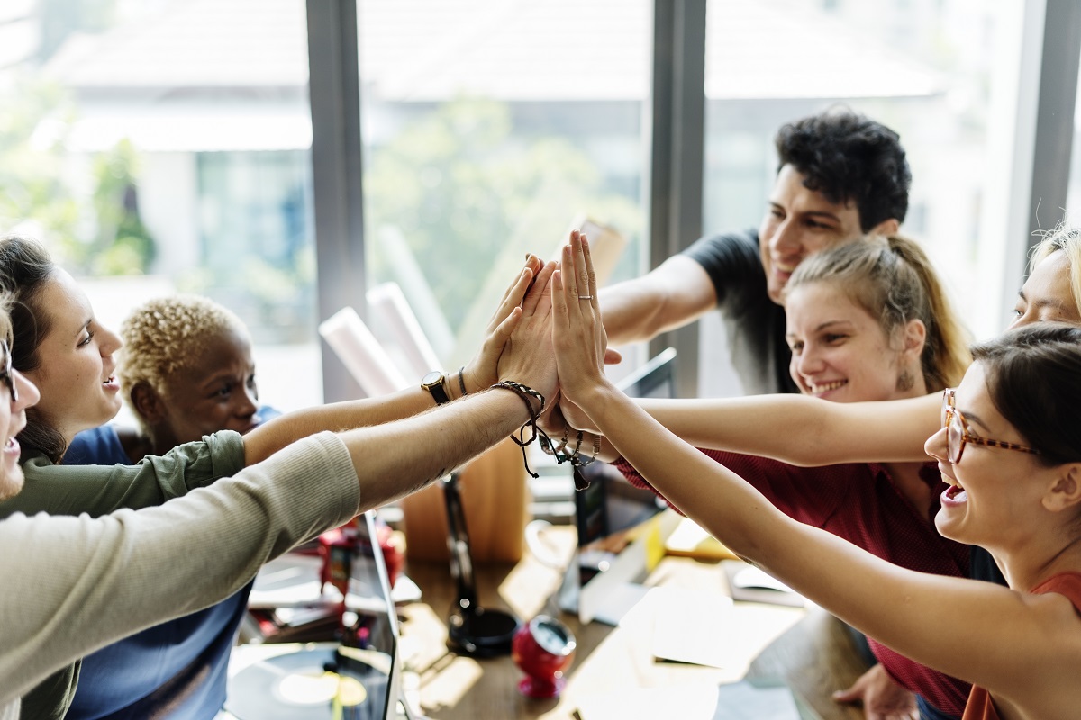 Employees working together as a team at an office.